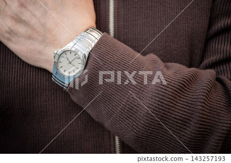 Wristwatch on mature man hand closeup Wristwatch on mature man hand closeup 143257193