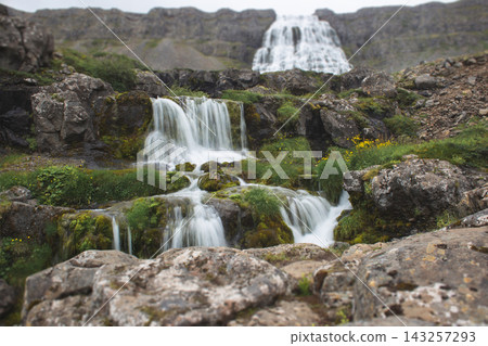 Lower cascades of Dynjandi waterfall with lush green rocks, Iceland Lower cascades of Dynjandi waterfall with lush green rocks, Iceland 143257293