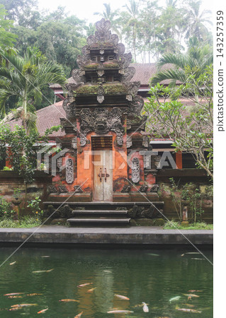 Ancient stone statues and holy springs at Tirta Empul Temple in Bali Ancient stone statues and holy springs at Tirta Empul Temple in Bali 143257359