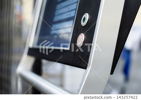 Control panel with screen and buttons outdoors Control panel with screen and buttons outdoors 143257422