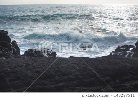 Dramatic volcanic cliffs and sea stack at Reykjanesviti coast in Iceland Dramatic volcanic cliffs and sea stack at Reykjanesviti coast in Iceland 143257511