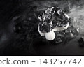Gothic christmas celebrating with dark santa hat and gifts 143257742