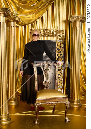 Commanding woman in elegant attire with regal background Commanding woman in elegant attire with regal background 143258820