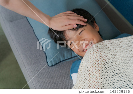 A boy sleeping on the sofa A boy sleeping on the sofa 143259126