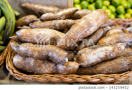 Yucca roots lie on counter of grocery store Yucca roots lie on counter of grocery store 143259452