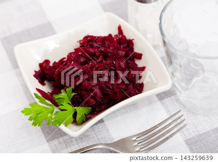 Salad of shredded boiled beets served with fresh greens Salad of shredded boiled beets served with fresh greens 143259639