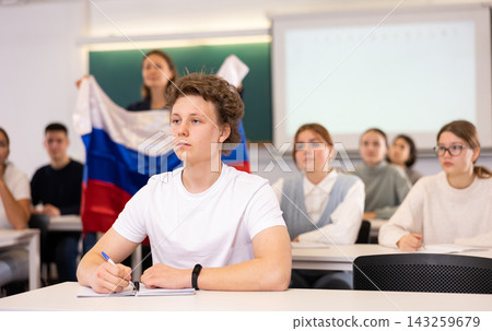 Young boy student studying diligently at school Young boy student studying diligently at school 143259679