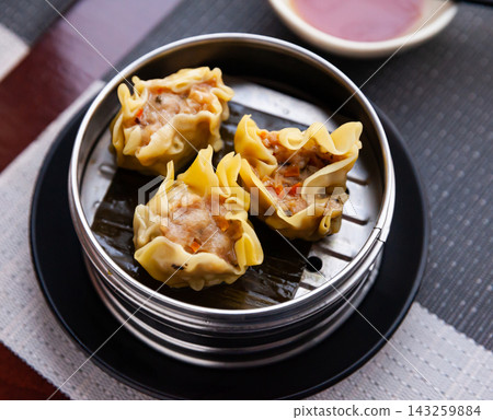 Japanese tasty dumplings siumai in steamer, nobody Japanese tasty dumplings siumai in steamer, nobody 143259884