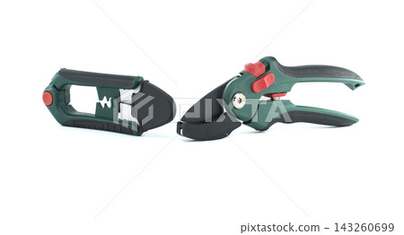 Garden Pruning Shears and Hedge Trimming Tool Displayed Side by Side on White Surface Garden Pruning Shears and Hedge Trimming Tool Displayed Side by Side on White Surface 143260699