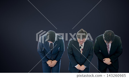 Three businessmen bowing deeply in apology against a dark background, symbolizing a scandal. Three businessmen bowing deeply in apology against a dark background, symbolizing a scandal. 143260985