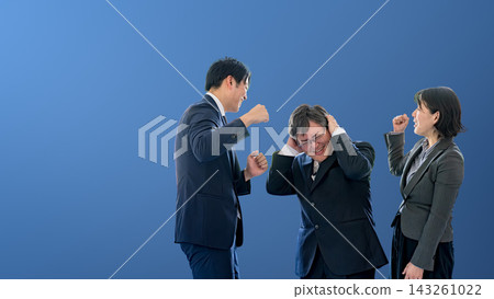 A boss is seen holding his head in his hands as his subordinate confronts him, against a blue background on the right side; this is harassment. A boss is seen holding his head in his hands as his subordinate confronts him, against a blue background on the right side; this is harassment. 143261022