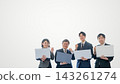 A male and female business person holding a laptop and making a triumphant gesture against a white background. 143261274