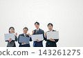 Four energetic employees holding laptops. White background with text space on the right. 143261275