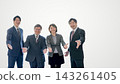 Four office workers, two men and two women, smiling and extending their hands against a white background; a large copy space on the right. 143261405