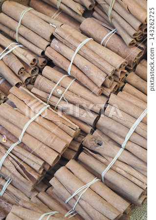 There are numerous bundles of cinnamon sticks available for purchase in the market There are numerous bundles of cinnamon sticks available for purchase in the market 143262725