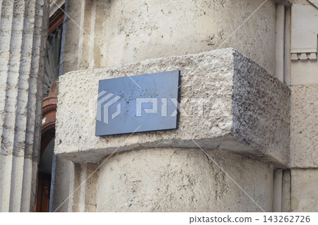 Blank sign on a stone pillar at an old building in a city Blank sign on a stone pillar at an old building in a city 143262726
