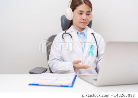 doctor using laptop for telehealth, online consultation and meeting about blue Ribbon concept of November Prostate Cancer Awareness month, Diabetes day , Men Health, International men, Father day. doctor using laptop for telehealth, online consultation and meeting about blue Ribbon concept of November Prostate Cancer Awareness month, Diabetes day , Men Health, International men, Father day. 143263088