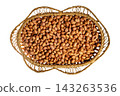 Traditional woven basket filled with raw unshelled peanuts harvest 143263536