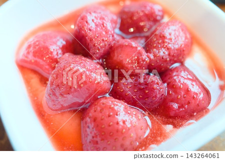 A spring fruit dessert generously topped with fresh, juicy strawberries. A spring fruit dessert generously topped with fresh, juicy strawberries. 143264061