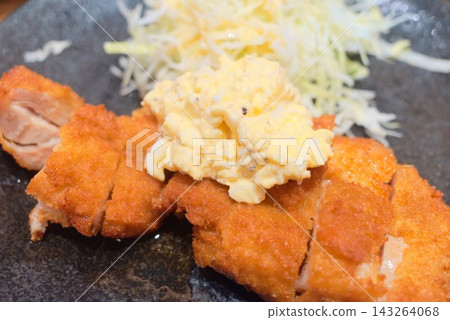 A dish of fried chicken with plenty of tartar sauce and shredded cabbage. A dish of fried chicken with plenty of tartar sauce and shredded cabbage. 143264068