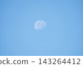 moon floating in the blue sky 143264412