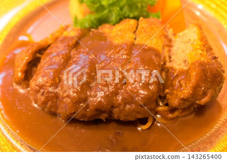 A Western-style plate featuring thick-cut minced meat cutlets topped with rich demi-glace sauce. A Western-style plate featuring thick-cut minced meat cutlets topped with rich demi-glace sauce. 143265400