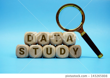 Data Study alphabet letters wooden cube and magnifying glass on blue background 143265808