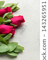 Red roses and eucalyptus leaves creating floral border 143265951