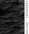 Dark animal fur surface showing soft hair fibers 143265953