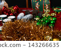Assorted Christmas Ornaments and Golden Tinsel 143266635
