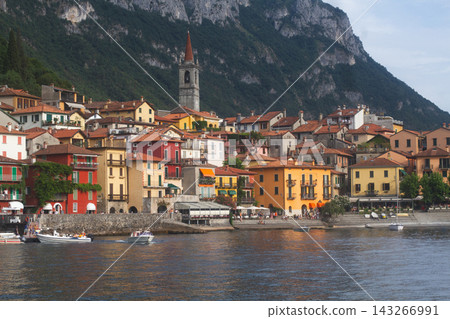 Charming coastal town of Varenna on Lake Como with colorful houses and San Giorgio church 143266991