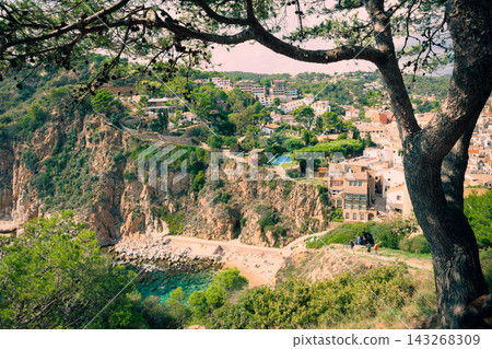 Rocky cove and cliffside coastline in Tossa de Mar on Costa Brava. Mediterranean destination for beach vacations scenic hiking and coastal tourism 143268309