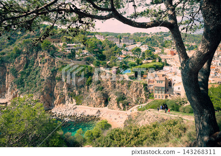 Coastal hiking destination near Tossa de Mar on Costa Brava coast. Hidden Mediterranean beach with turquoise water scenic cliffs eco tourism trails and outdoor adventure atmosphere 143268311