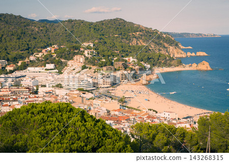 Panoramic view of Tossa de Mar beach and Costa Brava coastline in Spain. Mediterranean resort destination for summer vacations seaside tourism and coastal travel Panoramic view of Tossa de Mar beach and Costa Brava coastline in Spain. Mediterranean resort destination for summer vacations seaside tourism and coastal travel 143268315