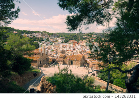 Medieval fortress walls near Tossa de Mar beach on Costa Brava in Spain. Historic Mediterranean destination for seaside vacations and cultural tourism Medieval fortress walls near Tossa de Mar beach on Costa Brava in Spain. Historic Mediterranean destination for seaside vacations and cultural tourism 143268331