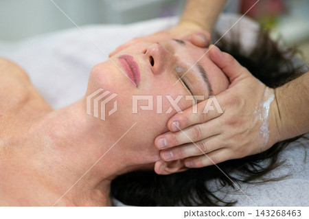 Professional facial massage and skin care treatment in spa salon Professional facial massage and skin care treatment in spa salon 143268463