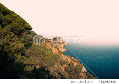 Rocky Costa Brava cliffs above Mediterranean Sea in Spain. Scenic coastal landscape for hiking travel seaside vacations and nature tourism 143268480