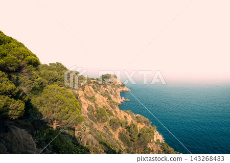 Panoramic view of Tossa de Mar beach and Costa Brava coastline from Vila Vella in Spain. Mediterranean destination for seaside vacations luxury resorts coastal tourism and summer travel Panoramic view of Tossa de Mar beach and Costa Brava coastline from Vila Vella in Spain. Mediterranean destination for seaside vacations luxury resorts coastal tourism and summer travel 143268483