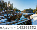 Timber Rafting Bridge (Rechle) near Modrava in Sumava National Park, Czech Republic, covered in snow and illuminated by sunset, connected to the historic Vchynice-Tetov rafting canal. 143268552
