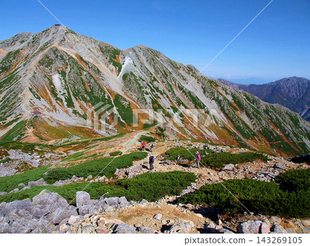 Hikers walking along the ridge leading to Tateyama and Oyama Hikers walking along the ridge leading to Tateyama and Oyama 143269105