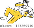 A man eating and drinking while lying down sloppily. 143269510
