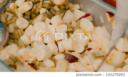 Fruit salad with bananas, peaches and kiwi served during Vaisakhi celebration Fruit salad with bananas, peaches and kiwi served during Vaisakhi celebration 143270093