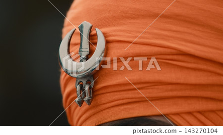 Symbol of Indian Sikh faith and religion during the Vaisakhi festival in turban Symbol of Indian Sikh faith and religion during the Vaisakhi festival in turban 143270104