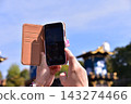 Inuyama City, Aichi Prefecture, Japan: Spring Inuyama Festival under a beautiful blue sky; floats gathered in front of Inuyama Castle Square; tourists taking photos with their smartphones. 143274466