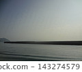 Breakwater and the calm, blue sea 143274579