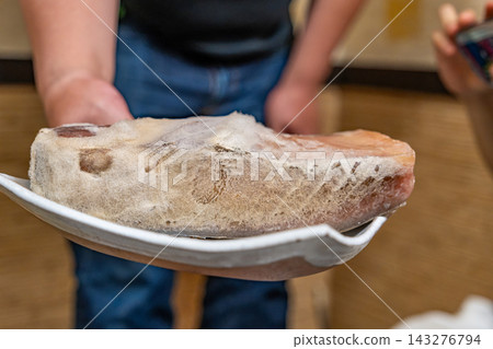 [#Food] A large piece of aged tuna with mold covering the surface. 143276794