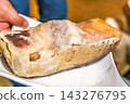 [#Food] A large piece of aged tuna with mold covering the surface. 143276795