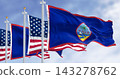 Flag of Guam waving in the wind with the US flag on a clear day 143278762