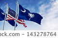 South Carolina state flags waving with the US flag 143278764