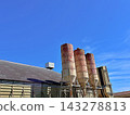 Rusty Silos On Steel Legs Under A Deep Blue Sky Rusty Silos On Steel Legs Under A Deep Blue Sky 143278813